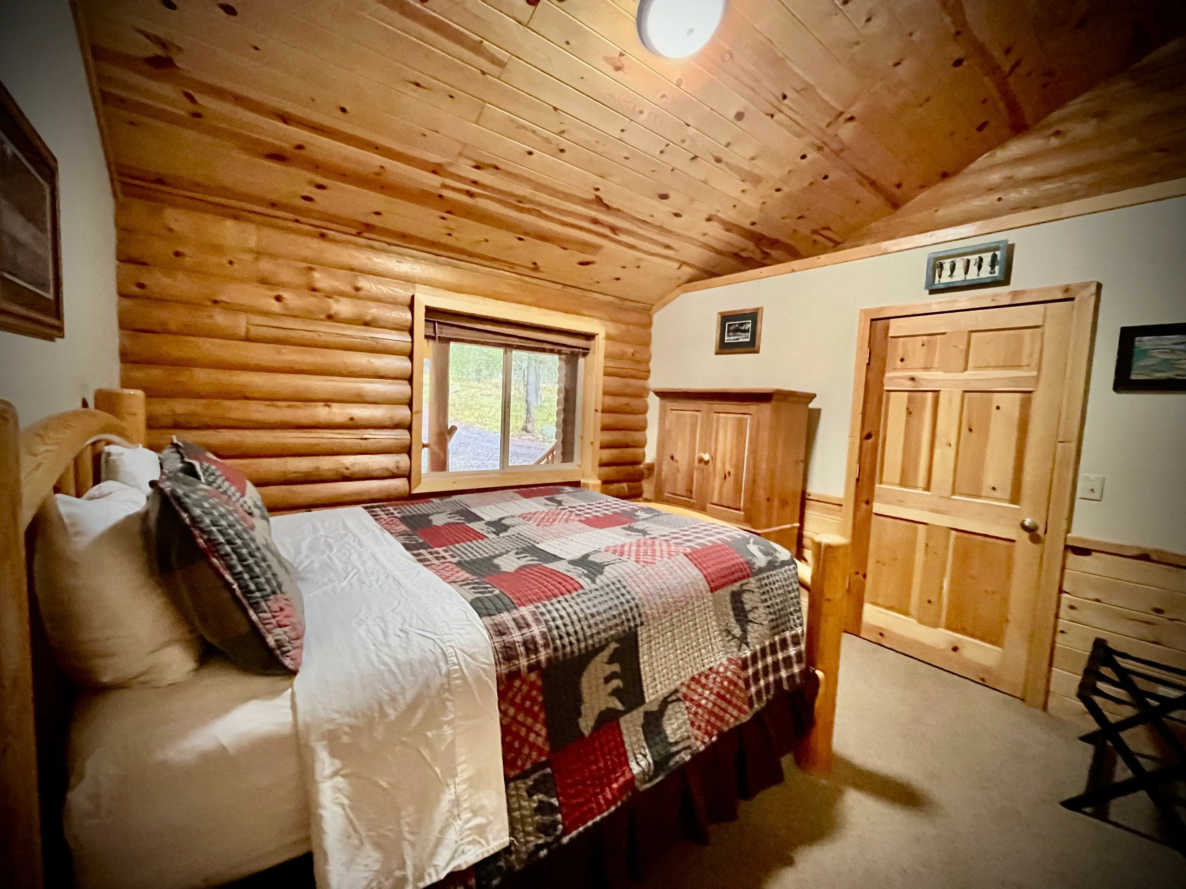 Fish room with view of deck and wooded forest