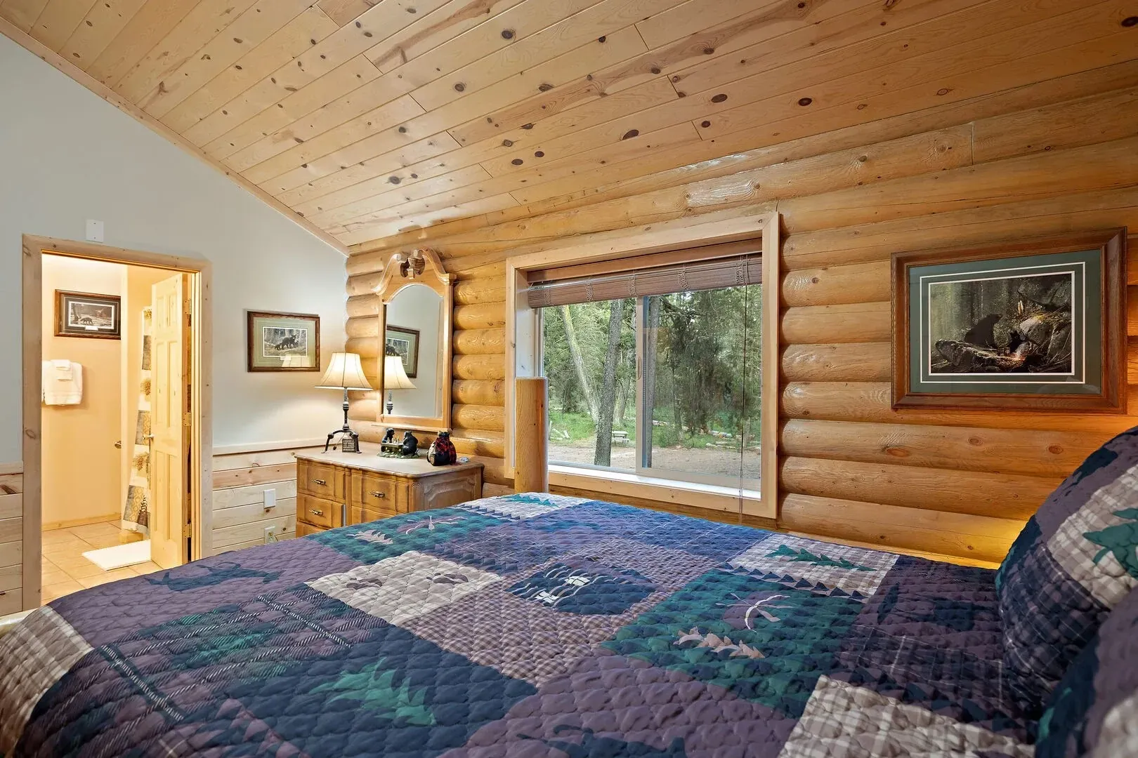 Bear-themed master bedroom with cozy log bed