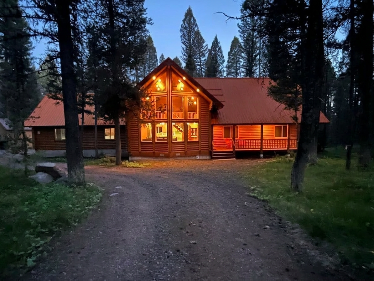 Log cabin near Yellowstone surrounded by lodgepole pines in winter