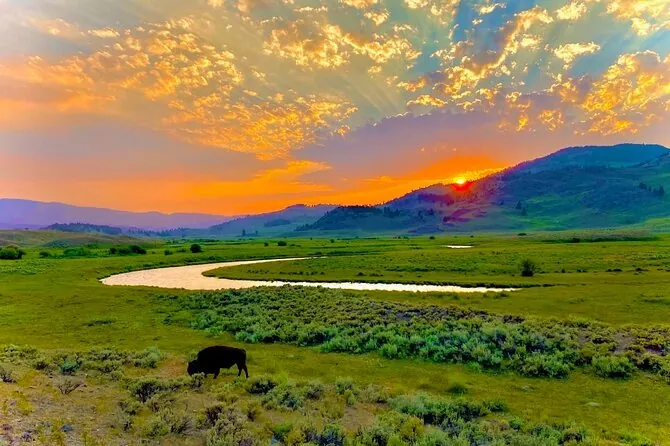 Sunrise over Lamar Valley in Yellowstone with golden light on the hills
