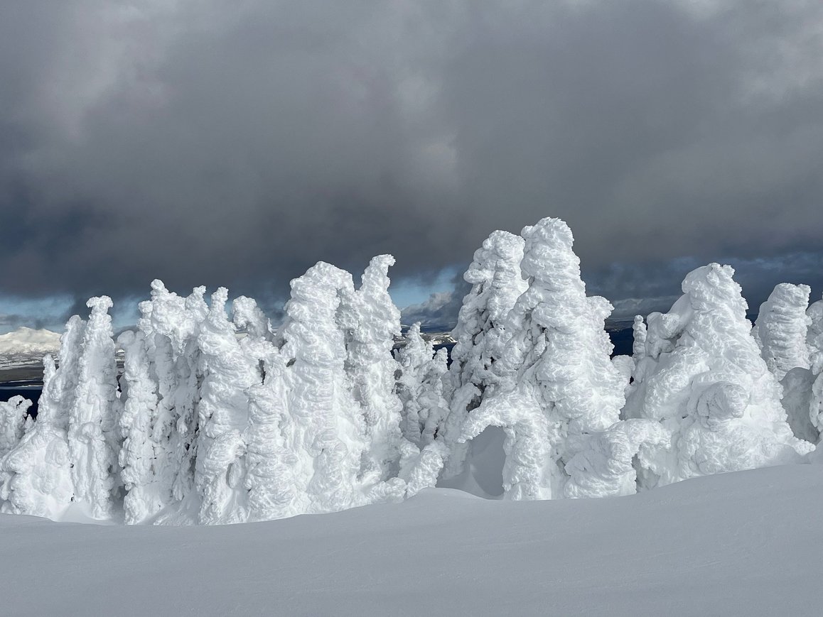 Snow ghosts on Two Top Mountain with dramatic clouds